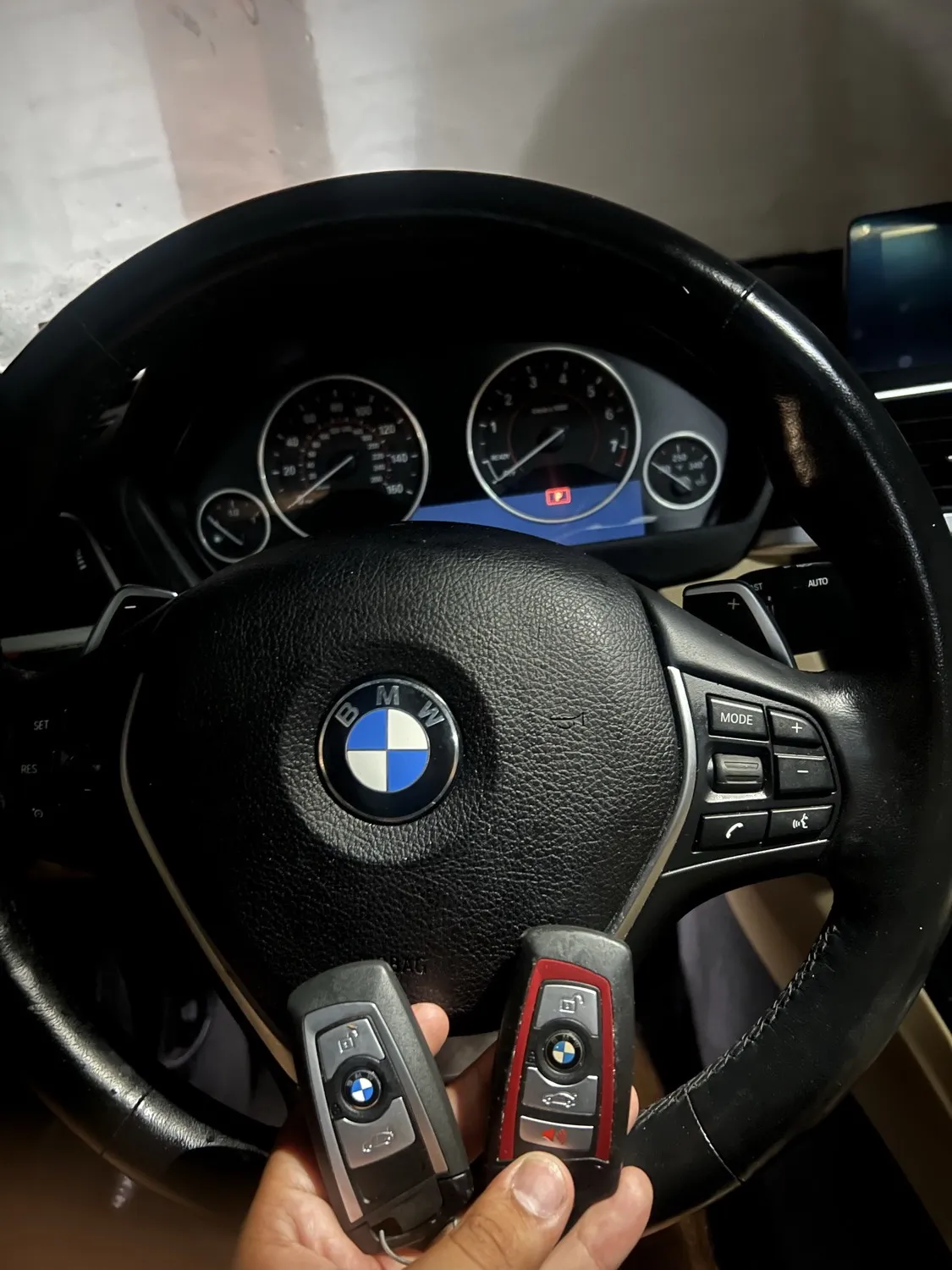 4Keys Locksmith technician programming BMW car keys on-site in Metro Atlanta