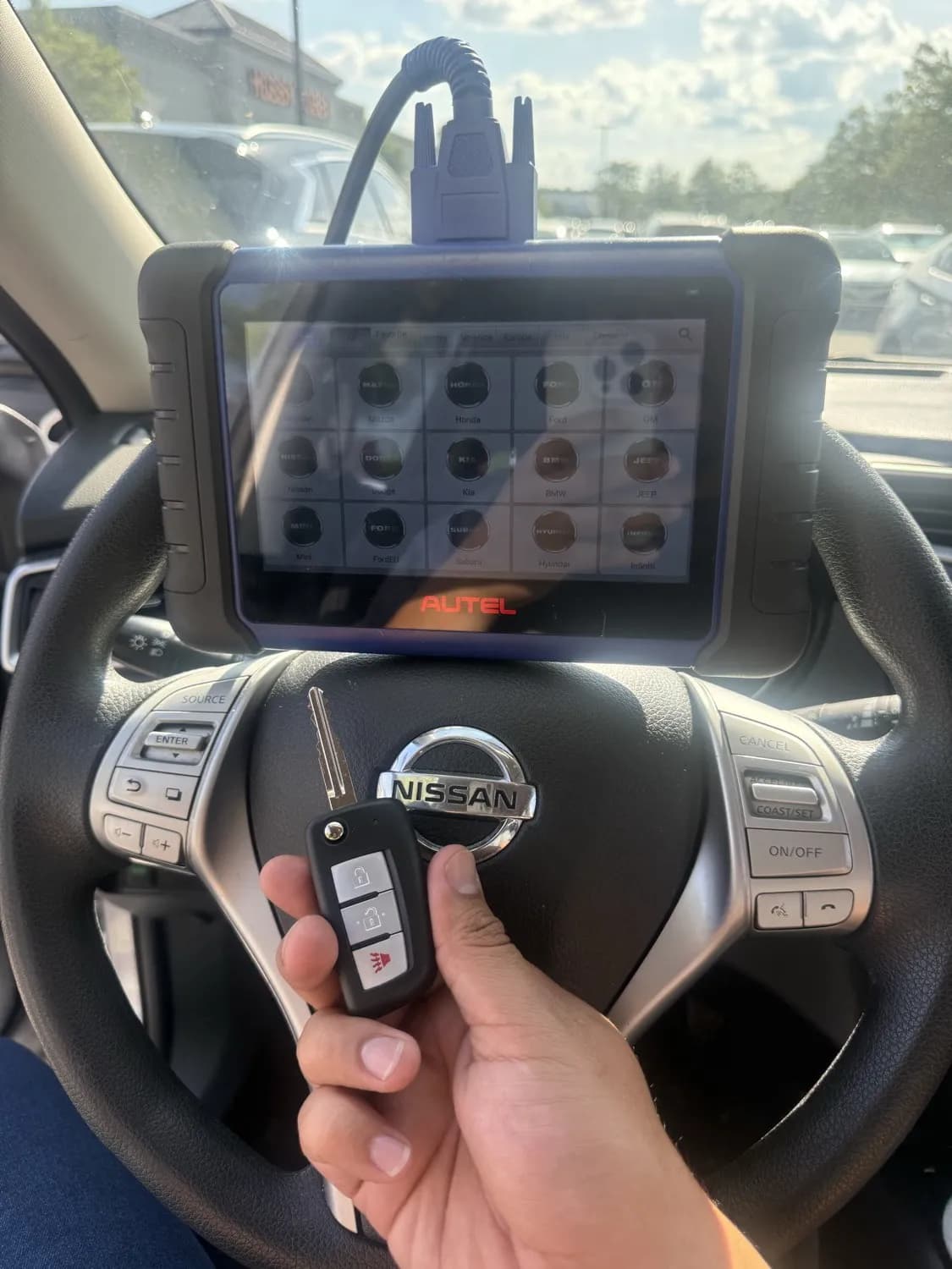 4Keys Locksmith technician programming Nissan car keys on-site in Metro Atlanta
